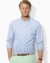 Polished stripes accent a trim-fitting, long-sleeved shirt in lightweight cotton poplin for a handsome, modern look.