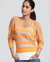 A lightweight knit makes this ALTERNATIVE striped top an all-too-perfect layer for the balmy season.