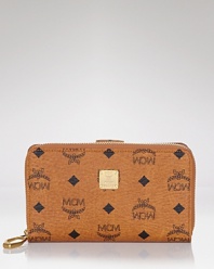 No purse is complete without the right wallet, and MCM's logo-splashed style is an edgy-glam choice. Cleverly designed with multiple pockets, it's an effortless essential.