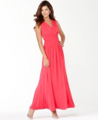 Light up the night in BCBGMAXAZRIA's boldly hued gown, featuring a diamond-shaped back cutout and sweeping silhouette.