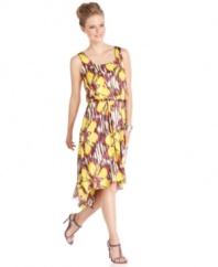 A beautifully bright floral print adorns this dress by Vince Camuto. The blouson-style fit and stylish high-low hem make it a must-have for summer!