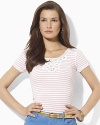 A ribbed cotton tee is infused with feminine inspiration, finished with delicate lace at the neckline.