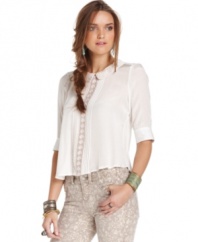 In a cool cropped length, the short hemline adds edge to this otherwise delicately feminine Free People blouse!