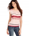 A summery striped top from INC gives any outfit a pop of bold color and graphic appeal.