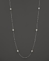 This sterling silver necklace, gleaming with freshwater pearls, makes an elegant statement. By Di MODOLO.