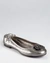Tory Burch's iconic Reva ballet is updated for the season in metallic pewter leather and polished gunmetal hardware.
