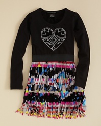 A tasseled native-print skirt and a rhinestone heart glyph blends old and new styles for a fresh look that feels thoroughly modern.