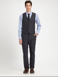 Add a finishing touch to a suit ensemble or a tailored structure to any casual look with this impeccably shaped, button-up vest, rendered in soft cotton for a handsomely modern feel.Button-frontWaist flap pocketsCottonDry cleanMade in USA