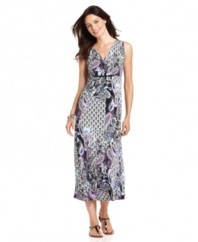 Maximize your style in this long, breezy dress from Elementz, featuring an empire waist and striking paisley print.