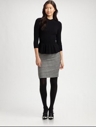 Featuring one of this season's hottest trends, peplum, this wool-blend sweater offers cozy-chic appeal.Mock turtleneckThree-quarter sleevesPeplum hemPull-on styleAbout 24 from shoulder to hem70% wool/20% angora/10% nylonDry cleanImported Model shown is 5'11 (180cm) wearing US size Small. 