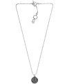 On the ball. This trendy pendant by Michael Kors puts the chic back into disco with pave-set black crystal accents and a silver tone mixed metal setting. Pendant strung from a ball chain with a toggle clasp and MK lock charm. Approximate length: 16 inches + 5-inch extender. Approximate drop: 1/2 inch.