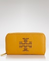 Tory Burch is the city girl's go-to for achingly cool yet effortless pieces, like this zip around wallet. Crafted from leather and stamped with the brand's logo, it's practical perfection.