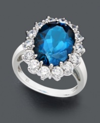 Instant elegance in pool blue hues. This regal ring features an oval-cut London blue topaz (7 ct. t.w.) encircled with a halo of round-cut white topaz (2 ct. t.w.). Crafted in 14k white gold.