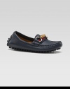 A slip-on style with a grown-up look and lots of Gucci details, including striped webbing, a bamboo horsebit and a sophisticated driver sole.Leather upperStriped webbed detailBamboo horsebit with golden hardwareRubber driver soleMade in Italy
