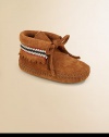 Adorned with traditional American braid detailing, fringe cut-out and front tie closure, these cozy little booties are boho chic for baby.Tie closureSuede upperRubber solePadded insoleImported