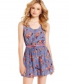 Endow your wardrobe with fresh-as-spring style with this belted, floral-print romper from American Rag!