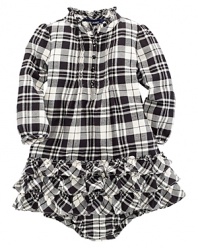 A traditional, festive plaid is constructed with a pintucked front and a flurry of ruffle trim along the neck and hem.