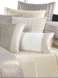 A collection of modern elegance, in soft neutral shades with rich textures, intricate patterns and lustrous finishes.Two-tone design with metallic borders and a center panel in a pleated grid pattern24 X 12Removable cover55% linen/45% cottonDry cleanImported