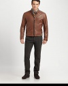 Ribbed knit banding, uniquely placed at the collar, shoulder and hem enhance the blousy effect of this jacket rendered in luxuriously soft lambskin leather.Two-way zip frontStand collarSide slash pocketsRibbed knit collar, shoulder and hem detailFully linedAbout 26 from shoulder to hemLeatherDry cleanImported