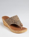 Take a walk on the wild side with Andre Assous' leopard printed Alyssa wedge--this thong toe, espadrille silhouette is easy to slip on and go.