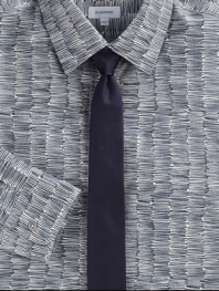 Scribble print pattern is artfully woven in crisp cotton, lending a modern twist to a classic dress shirt silhouette.Button-frontPoint collarCottonDry cleanMade in Italy