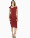 A timeless sheath dress in figure-flattering matte jersey is modernized in a cap-sleeved silhouette with elegant draping at the hip.