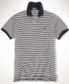 A classic-fitting short-sleeved polo shirt is crafted from breathable cotton mesh with a sleek striped pattern for casual polish.