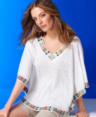 Work the season's tribal print trend into your wardrobe effortlessly with INC's linen poncho. The sequined and embellished trim adds a touch of color, too.