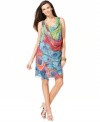 Ellen Tracy's dress is outfitted with a graceful drape and features a colorful, peacock inspired print.