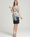A watercolor-inspired floral print dress from Elie Tahari delivers artful elegance. A waist-cinching belt and ladylike silhouette up the style factor.