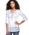 Tie dye gives RXB's tunic a boho-chic look, while feminine flourishes make it uniquely alluring!