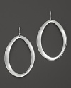 Large oval hoop earrings in sterling silver with a subtle wavelike effect. Designed by Ippolita.