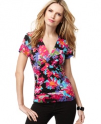 Cable & Gauge's classic twist-front top blooms with a bright floral print. The everyday low price makes it a perfect wardrobe-building staple!