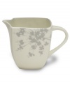 A modern blossom brings an air of tranquility to this chic squared creamer from Mikasa. In gleaming white bone china for a clean, minimalist feel.