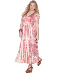 Spring into a stunning look with Style&co.'s short sleeve plus size maxi dress, featuring an electrifying sublimated print.