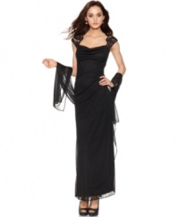Xscape's dress is made captivating with lace cap sleeves and an elegant sheer shawl to drape at your arms.