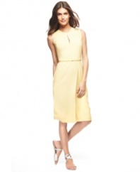 A dress that defines chic minimalism. Subtle touches--slender keyhole cutouts, a slim belt and a graceful, wrap-style skirt--combine for a look that's both simple and striking. By Francisco Costa for Calvin Klein.