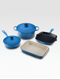 This essential collection of Le Creuset cast iron is perfect for newlyweds or a new kitchen. Durable stoneware evenly distributes and retains heat.