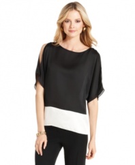 Don't sacrifice style when dressing for the office! Nine West has your needs covered with this beautiful blouse, featuring a colorblocked hem and a pretty split-sleeve design.