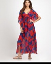 In living color, an airy, maxi dress with feminine, flutter sleeves and flattering, drawstring ties.Deep v-necklineSplit, flutter sleevesDrawstring Empire waistEngraved cord endsSilkDry cleanImported