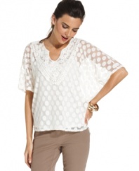 A sheer, floaty top from Alfani gets romantic with a whimsical dot pattern, batwing sleeves and a charming crocheted neckline. Make it office-appropriate with sleek pants or give it date-night drama by adding a skirt and statement heels.