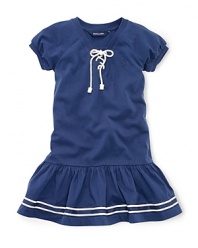 A drop-waist cotton jersey dress with nautical-inspired details is the perfect mix of sportswear and girlie style.