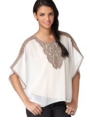 With an embroidered bib front and trendy poncho silhouette, this Bar III blouse is the perfect top for any pair of jeans.