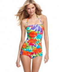 A tropical floral print makes a stylish statement on this Swim Solutions retro-inspired one piece swimsuit. Allover ruching and tummy control streamline the silhouette!