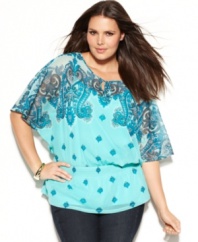 Get noticed this spring with INC's butterfly sleeve plus size top, cinched by a smocked waist.