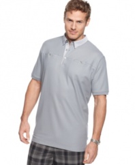 Beyond the basic. Add a touch of detail to your classic style with this pocketed polo shirt from Calvin Klein.
