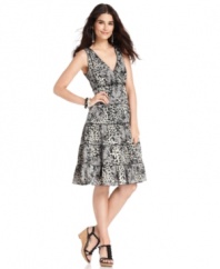 Wildly feminine: Style&co.'s dress features a mix of animal and lace prints on a pretty A-line silhouette. A subtly ruffled empire-waist and tiered effect on the skirt add to the allure.