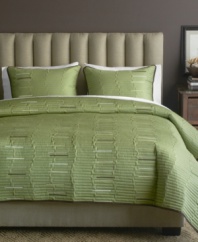 Luxe texture meets a serene green hue in this Key West sham from Bryan Keith for a calming oasis in the bedroom. Lush quilted details form an uneven stripe design with pops of muted color interspersed.
