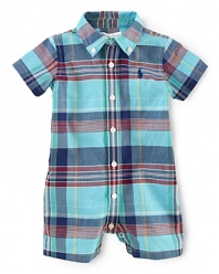 A traditional button-down silhouette in airy woven cotton is converted into an adorable short-sleeved shortall for breathable comfort during the warmer months.