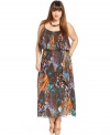 Have all eyes on you in Baby Phat's sleeveless plus size maxi dress, flaunting a peacock print!